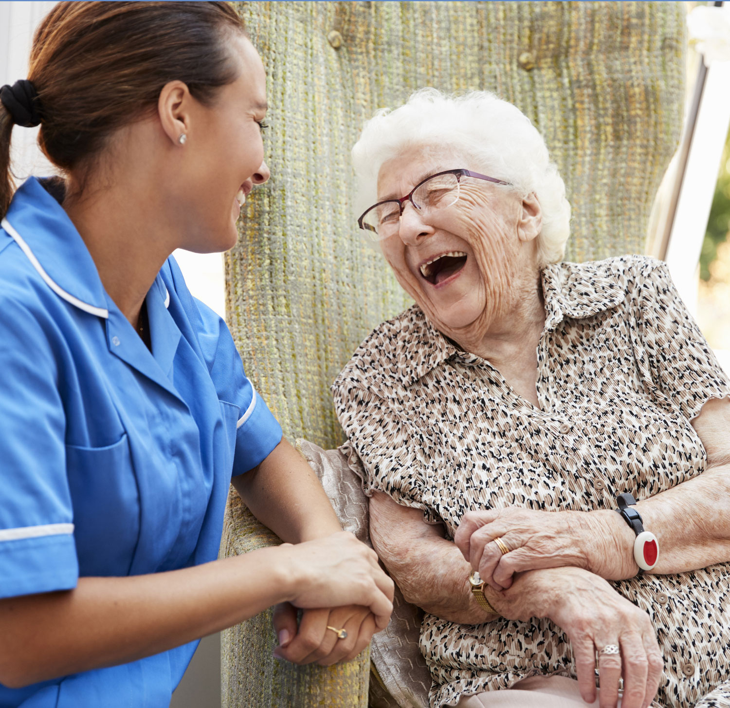 Elder Women laughing with nurse